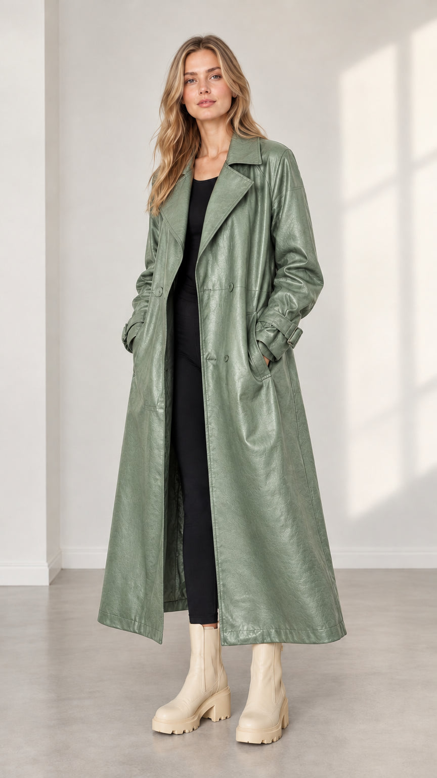 Model wearing sage green faux leather long trench coat