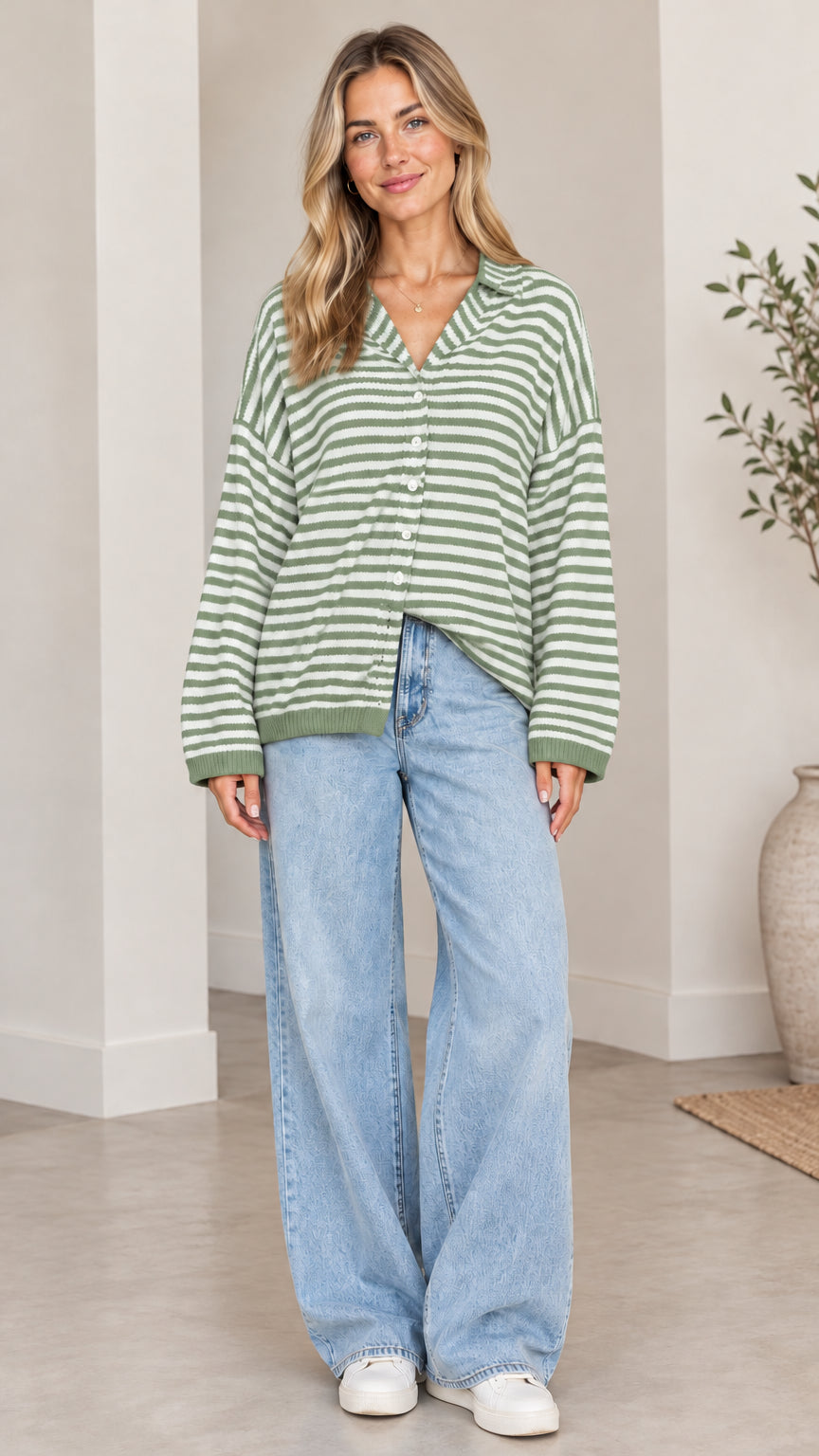 Front full-length view of woman wearing sage green and white striped collared cardigan sweater