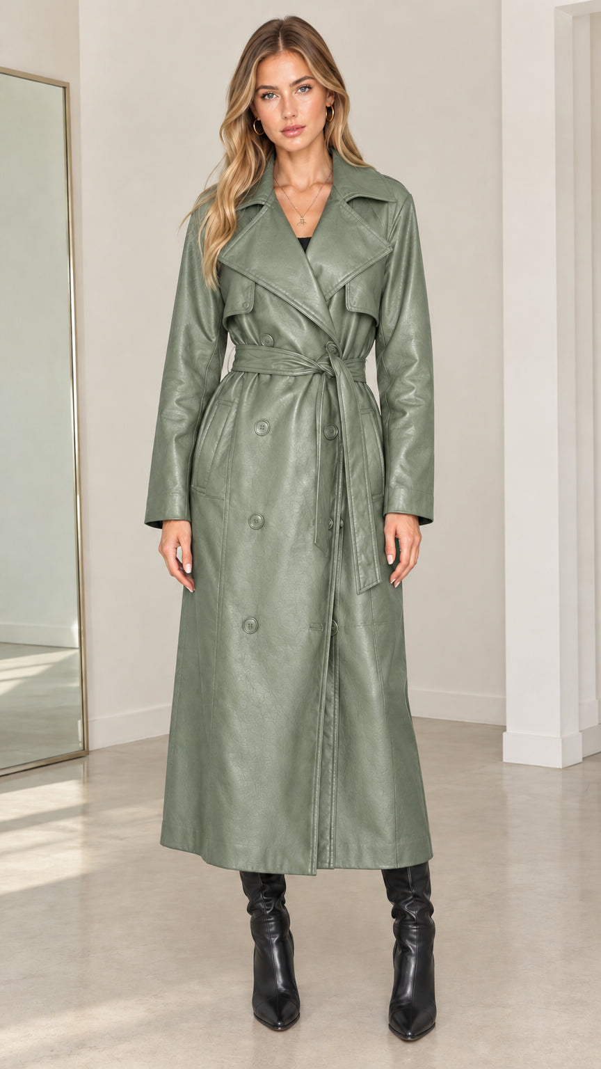 Front view of model wearing sage green faux leather double-breasted maxi trench coat
