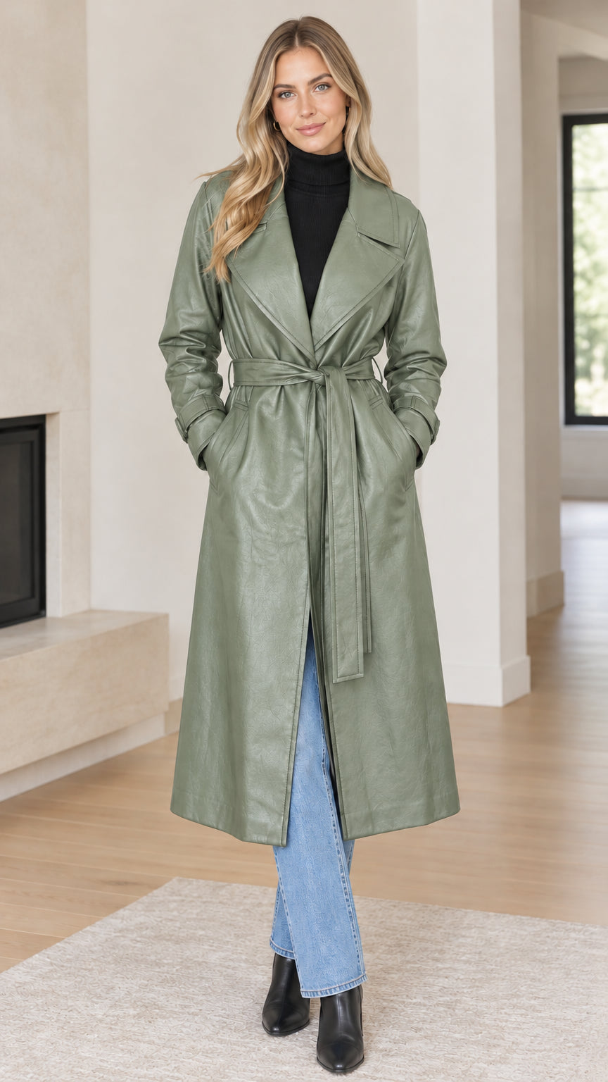 Front full view of woman wearing sage green faux leather belted trench coat