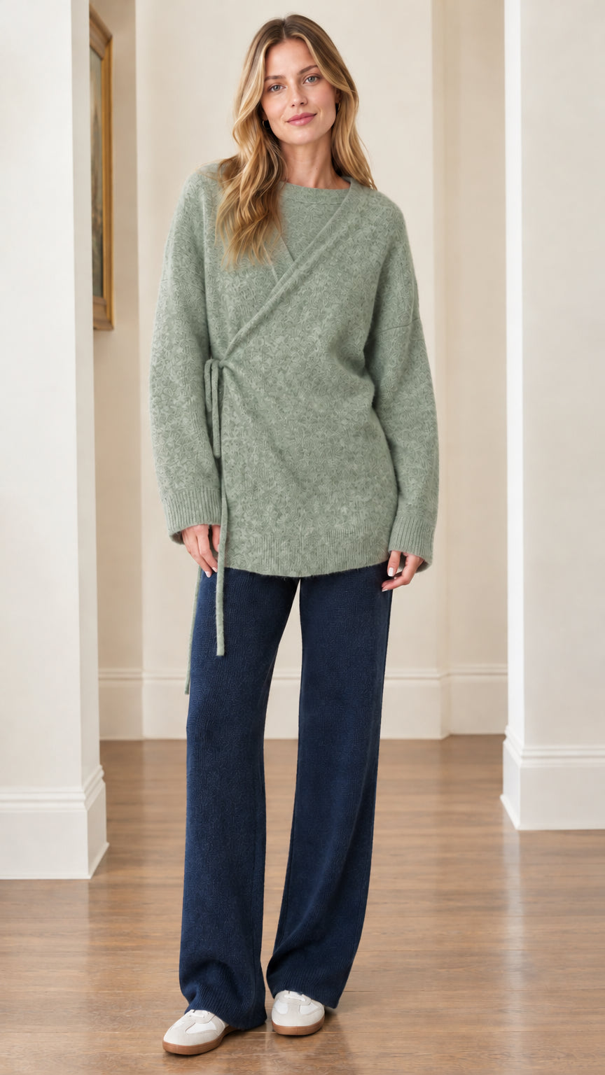 Woman wearing Sage Green long sleeve side-tie knit pullover