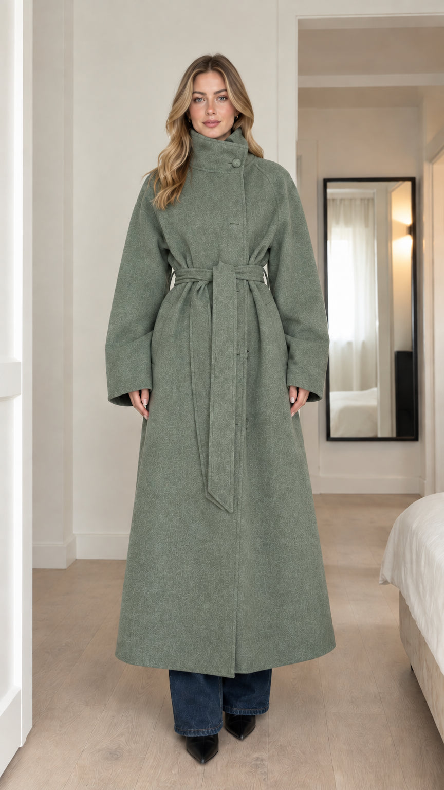 Front full-length view of model wearing sage green high-neck belted maxi coat