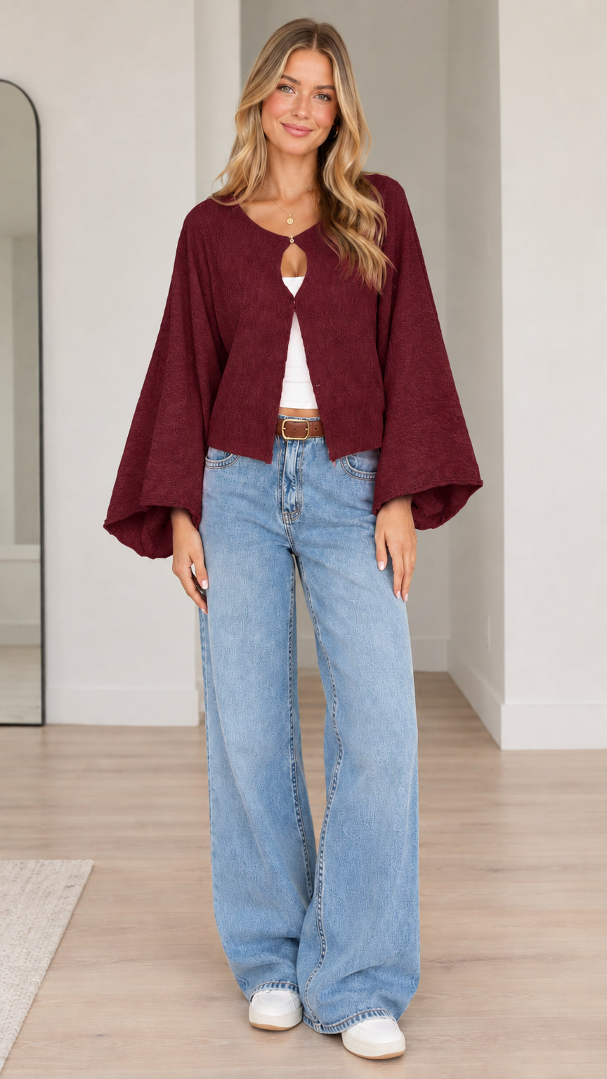Model wearing burgundy wine textured bell sleeve cardigan