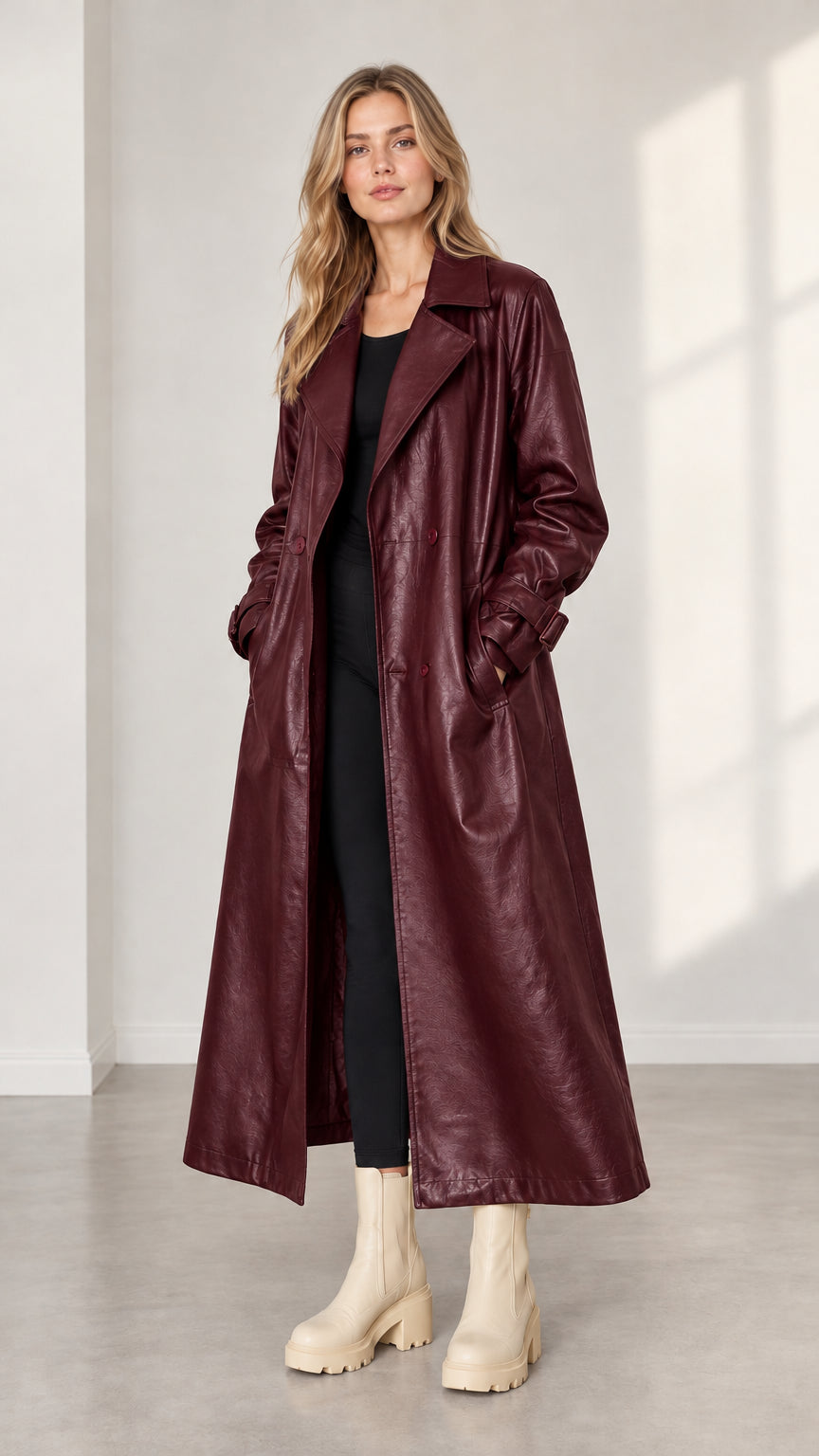 Model wearing deep burgundy wine faux leather maxi trench coat