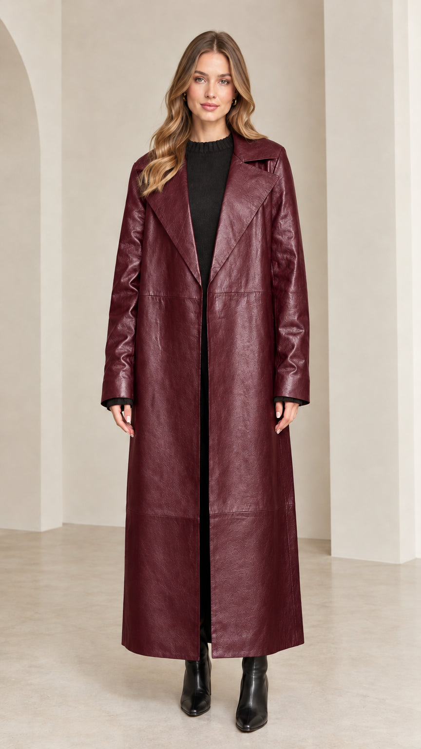 Full front view of rich burgundy wine maxi faux leather trench coat on model