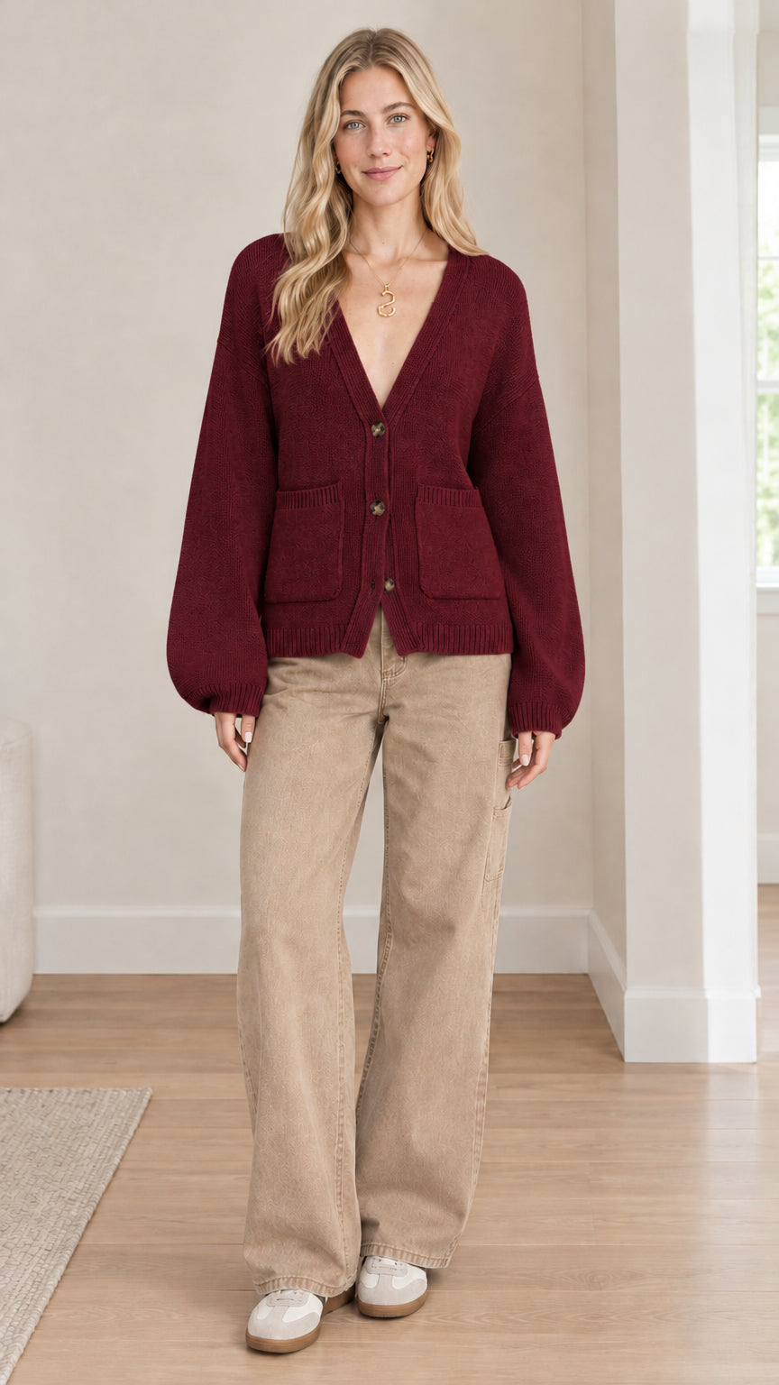 Front full-length view of model wearing burgundy red button-up knit cardigan