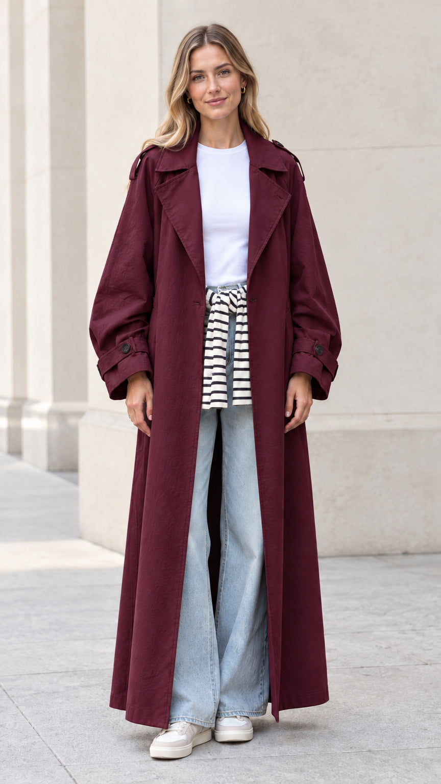 Front full view of woman wearing burgundy wine long duster trench coat