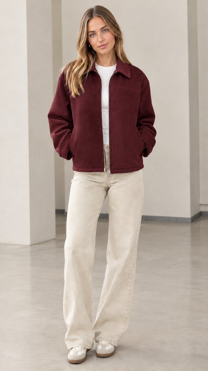 Front view of model wearing the burgundy full-zip collared jacket