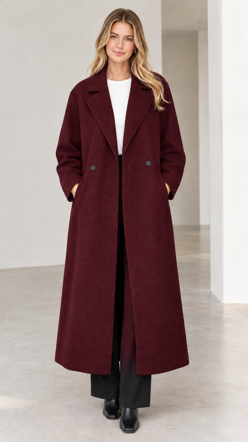 Full-length view of woman wearing deep burgundy longline winter coat