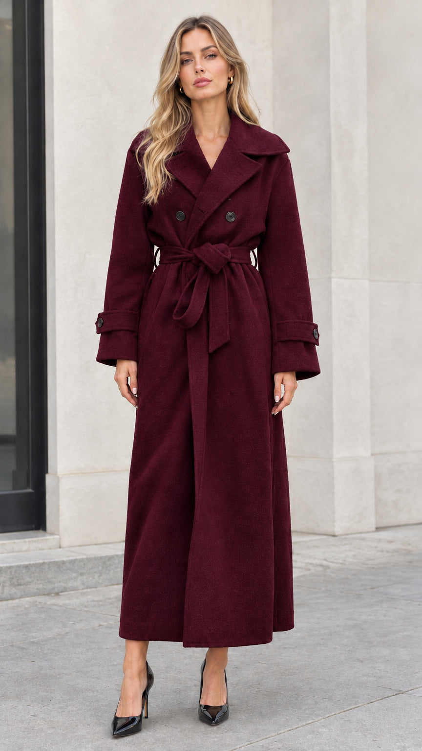 Front full-length view of woman wearing burgundy wine red double-breasted long coat