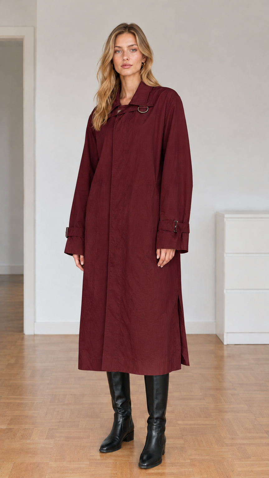 Front view of model wearing burgundy wine longline trench coat