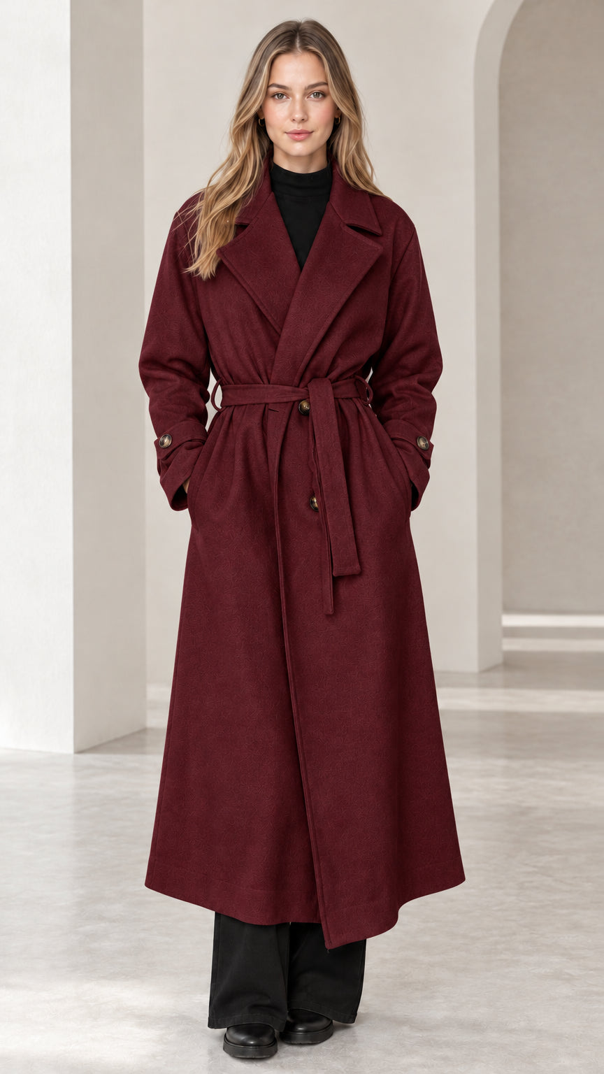 Front view of woman wearing burgundy wine red long belted trench overcoat