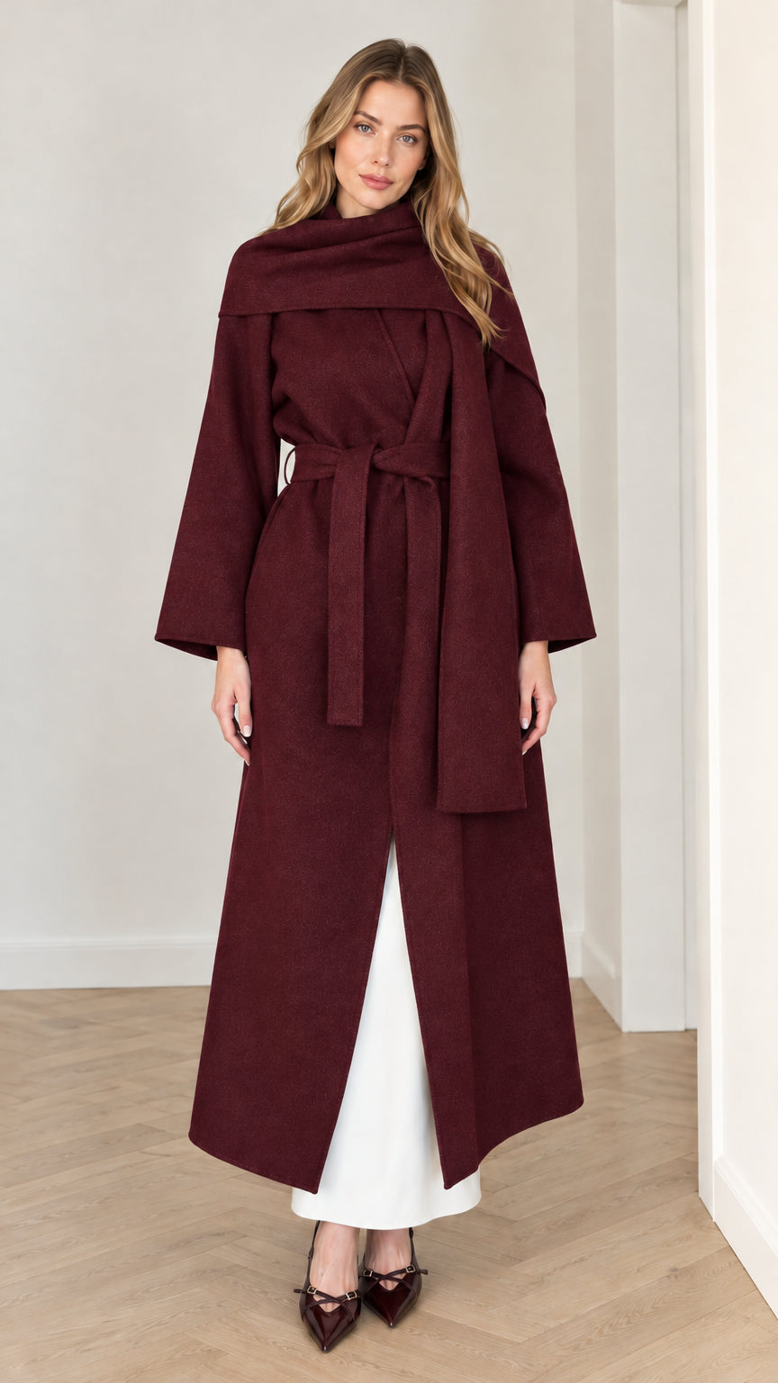 Model wearing rich burgundy wine belted maxi wrap coat with drape scarf