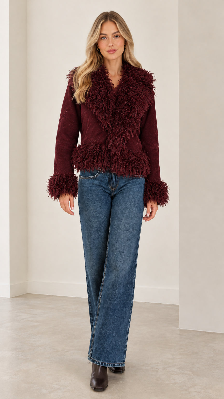 Full front view of the rich burgundy faux suede jacket featuring plush shaggy accents