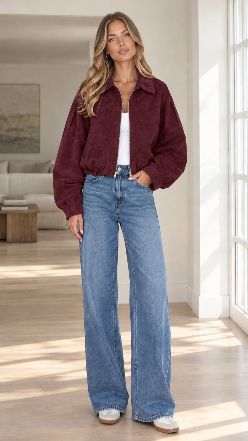 Front view of model wearing burgundy wine cropped faux suede bomber jacket