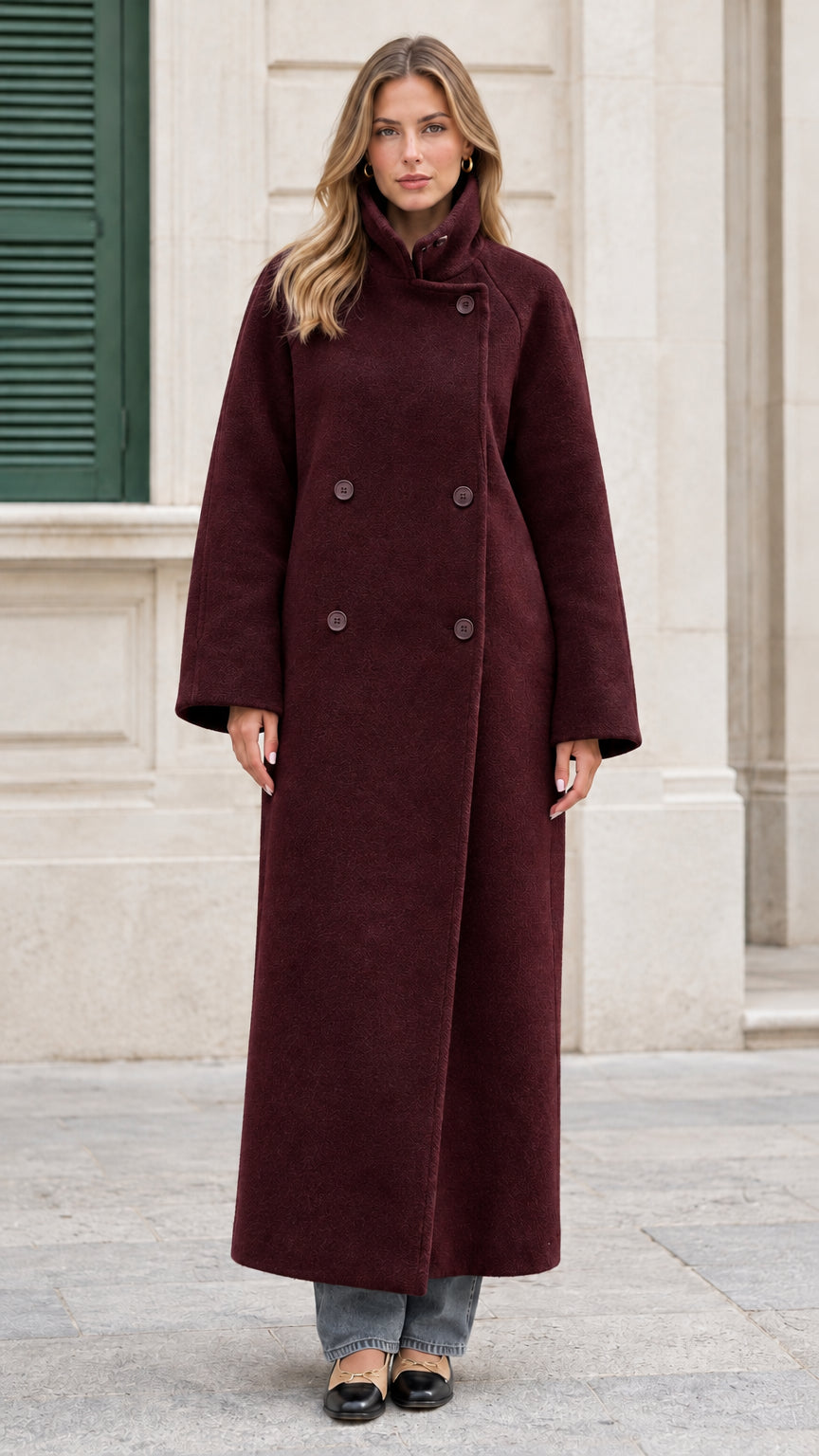 Front view of the burgundy wine double-breasted maxi overcoat on model