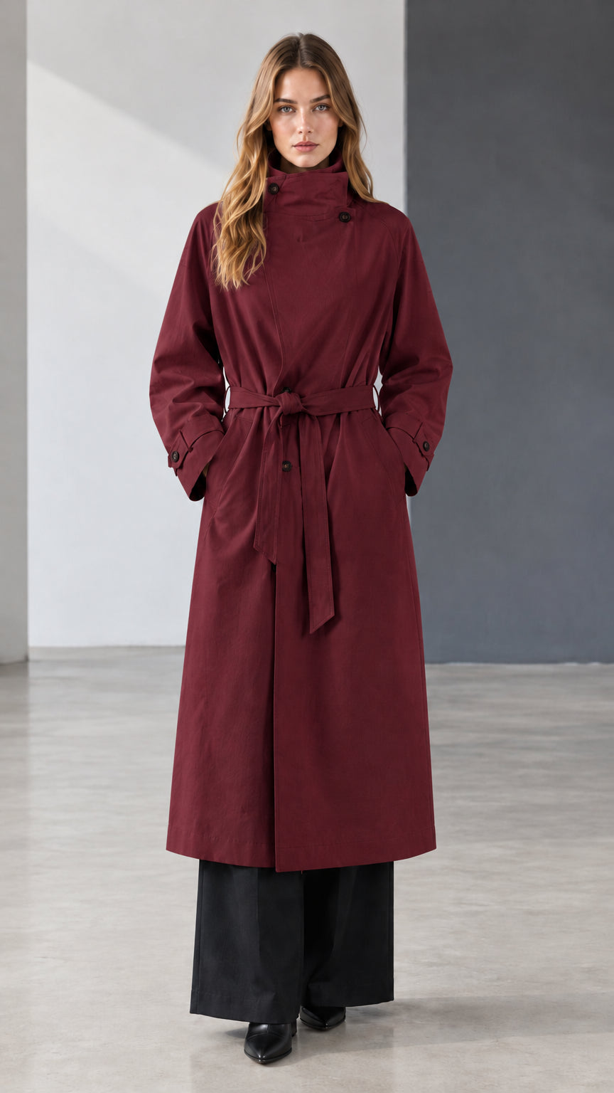 Front view of model wearing burgundy wine belted longline trench coat
