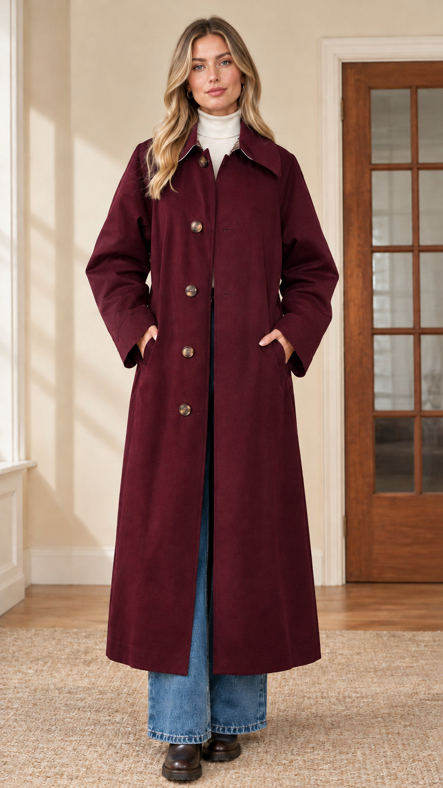 Full front view of woman wearing burgundy wine red maxi single-breasted trench coat