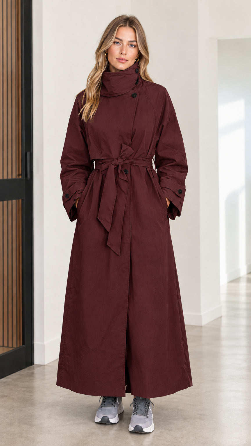 Full front view of women's burgundy wine high neck maxi belted trench coat