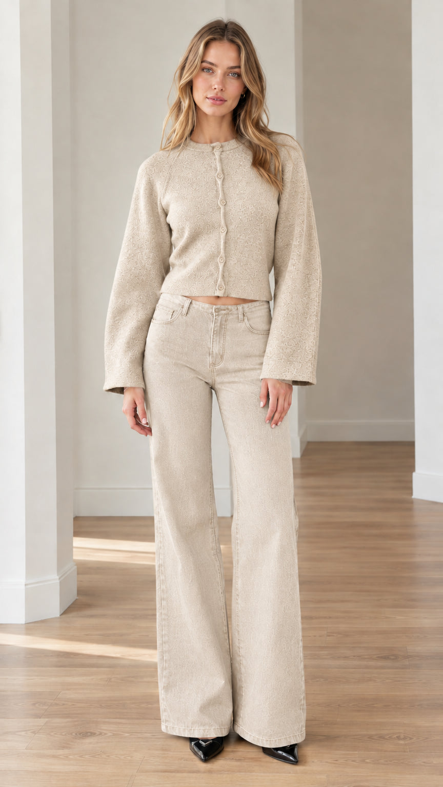 Model wearing cream oatmeal cropped knit cardigan with matching light-toned wide-leg pants