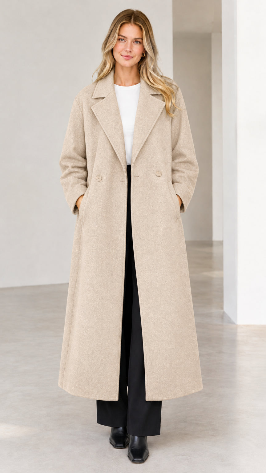 Full-length view of woman wearing neutral beige longline tailored overcoat