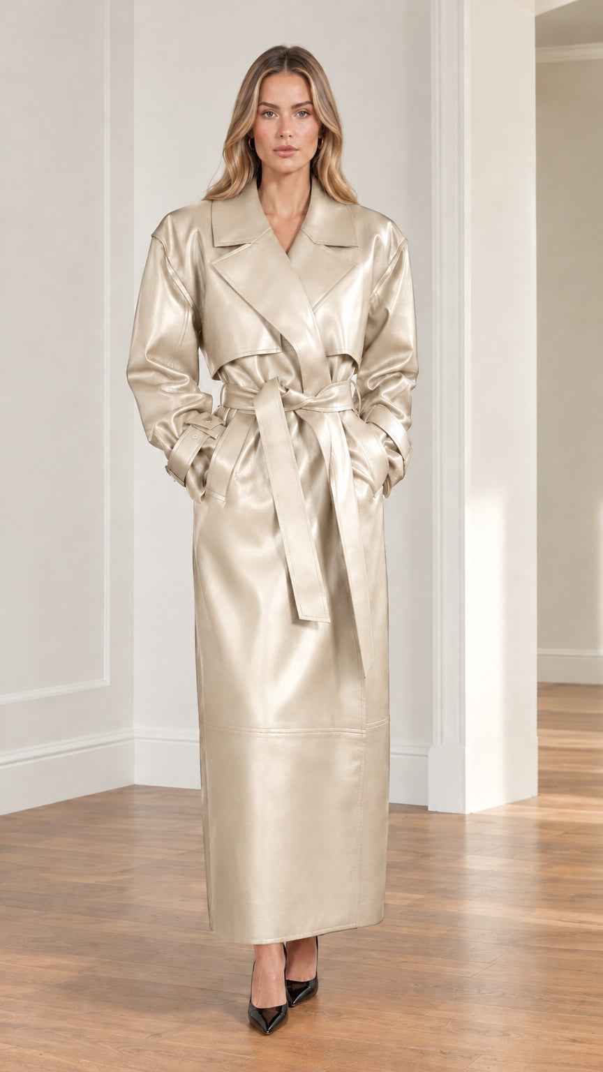 Model wearing champagne metallic faux leather maxi trench coat