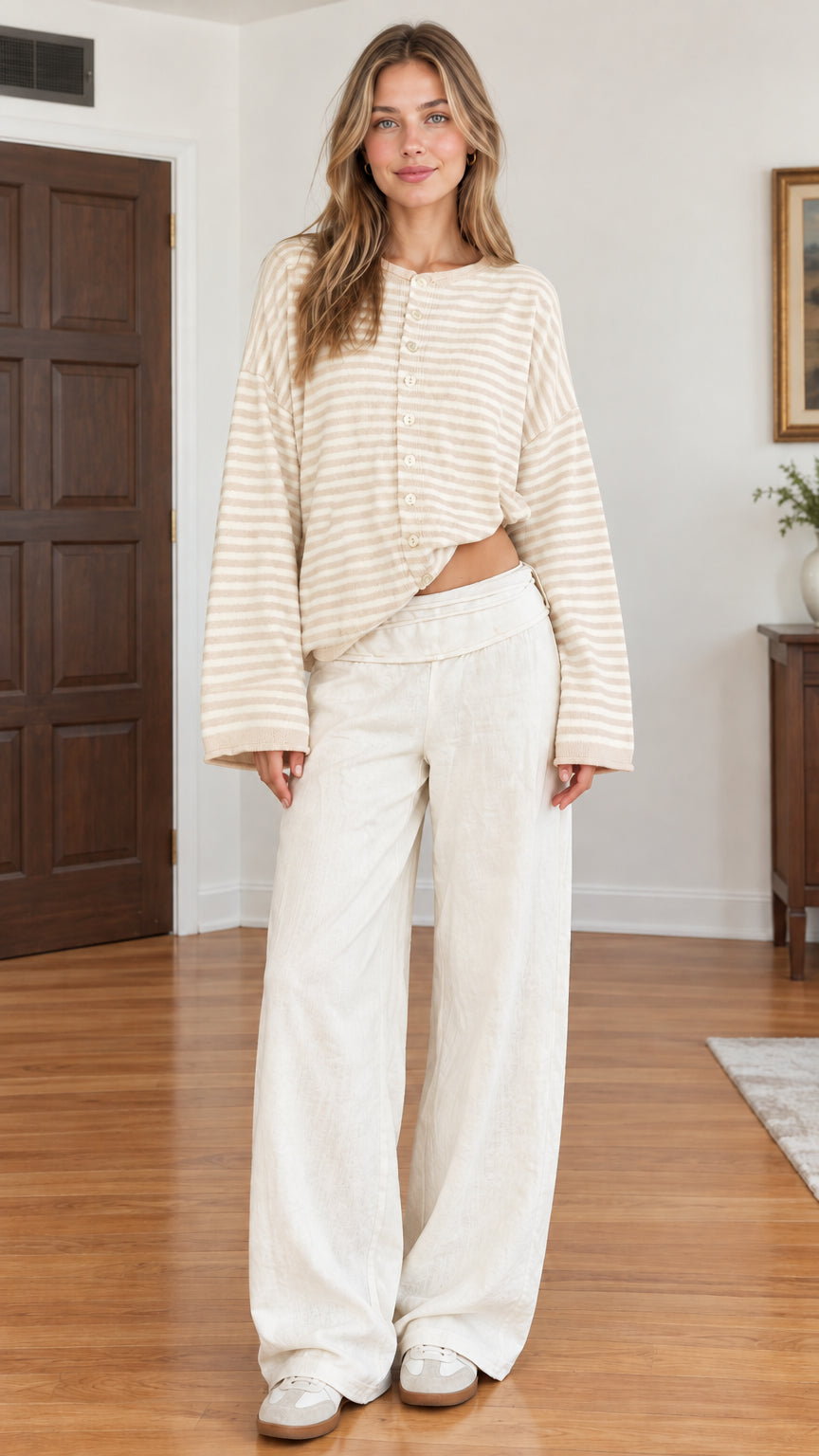 Full-length studio shot of beige and white striped button-front cardigan on model