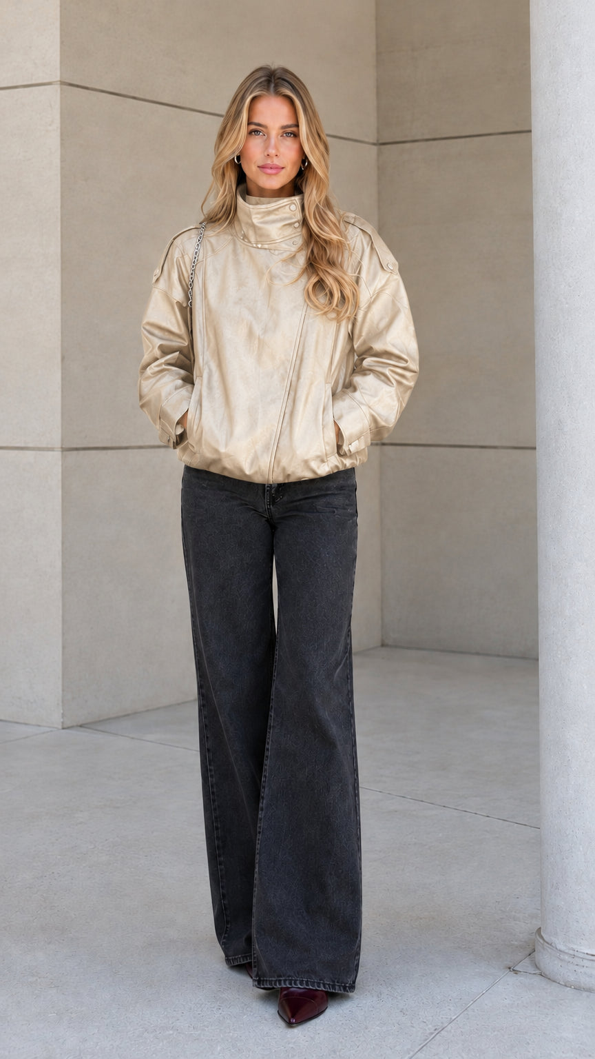 Front view of model wearing the champagne beige high-neck zip-up bomber jacket