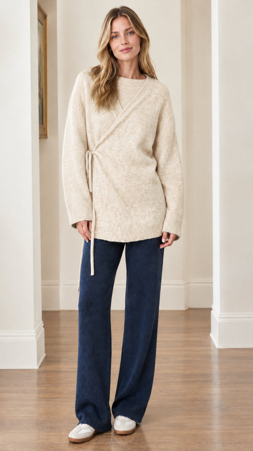 Woman wearing Cream oatmeal side-tie relaxed tunic sweater