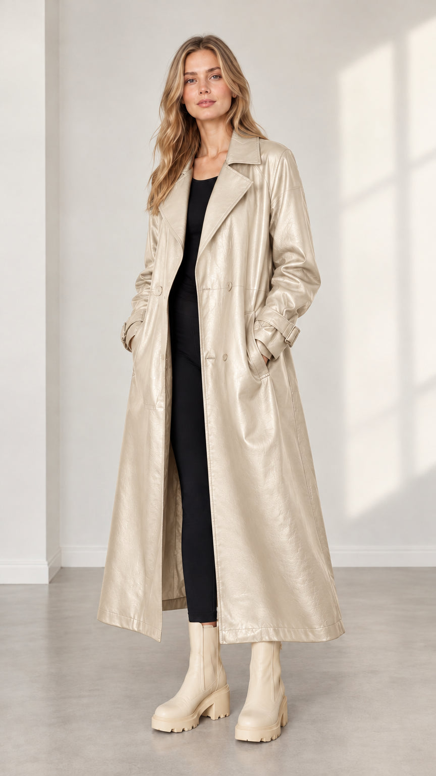 Model wearing champagne metallic faux leather long trench coat