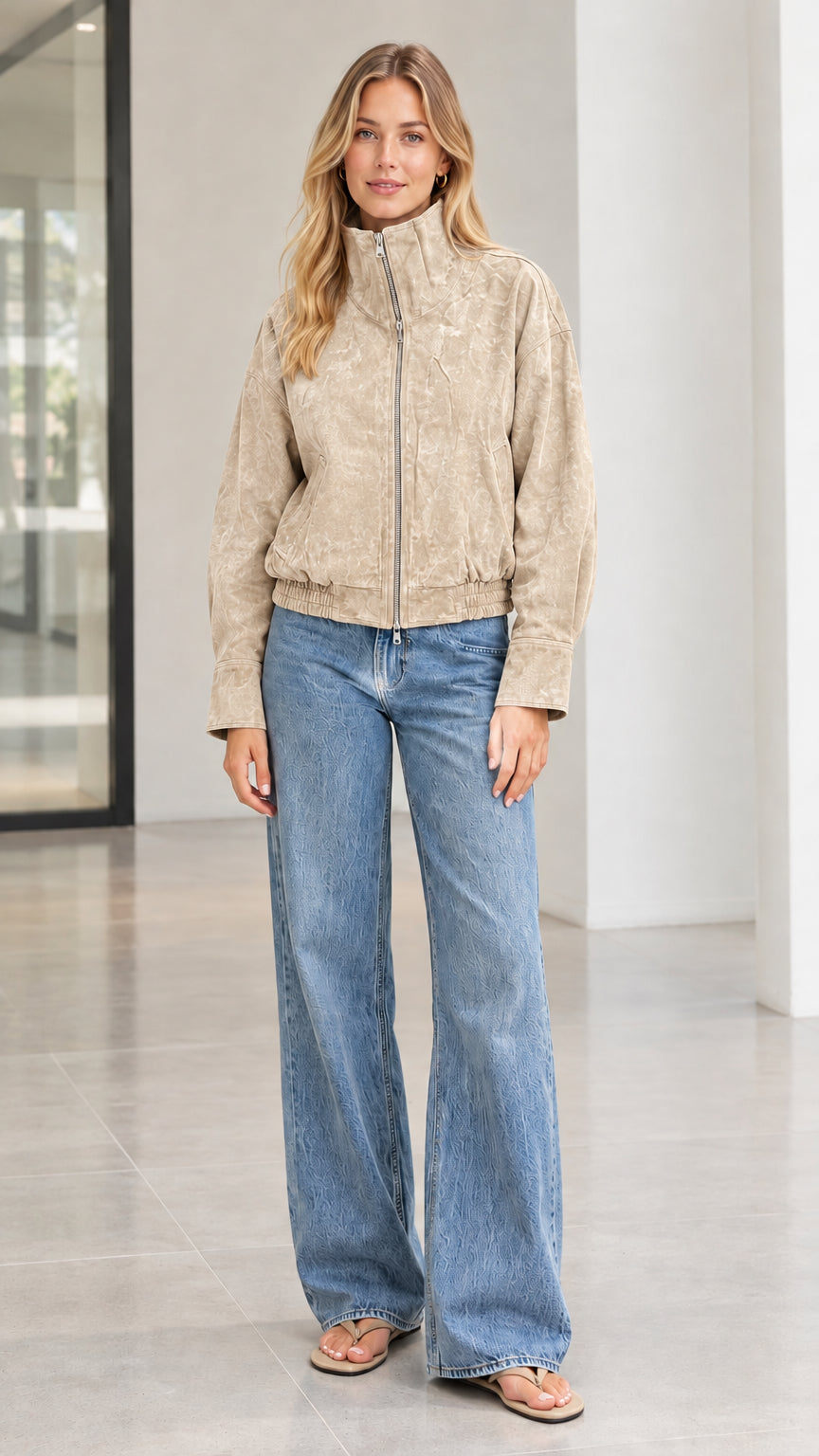Woman wearing beige khaki textured corduroy zip bomber jacket