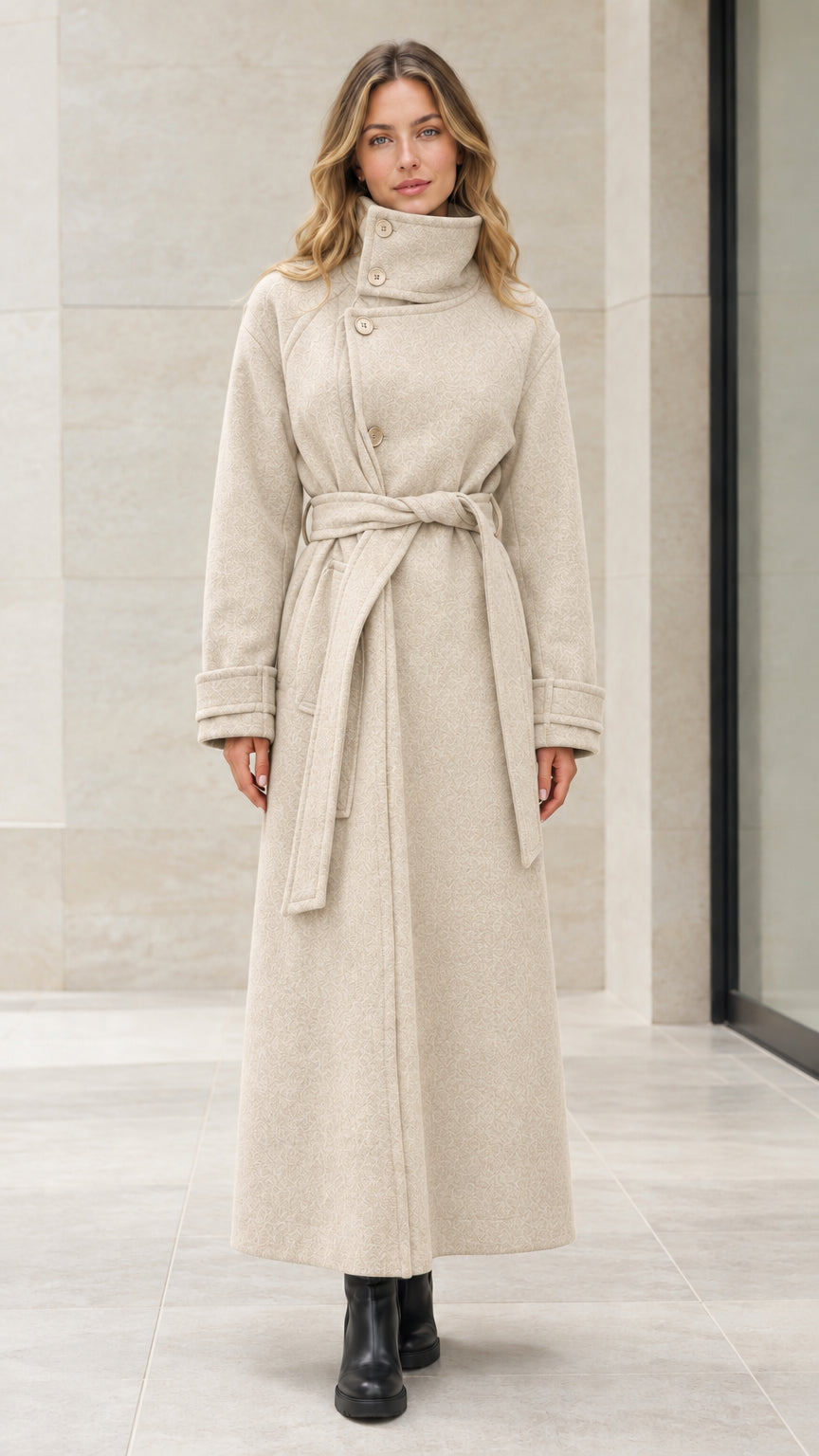 Front view of woman wearing cream beige high neck belted maxi overcoat